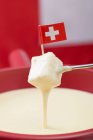 Cheese fondue with flag — Stock Photo