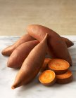 Whole and Slices Yams over white cloth — Stock Photo