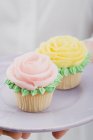 Cupcakes with marzipan roses — Stock Photo