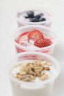 Yoghurts with berries and cereal — Stock Photo