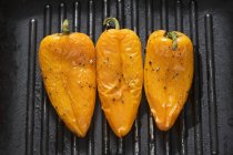 Peppers in grill frying pan — Stock Photo
