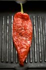 Red pepper in a grill frying pan — Stock Photo