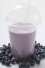Blueberry shake in plastic cup — Stock Photo