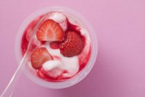 Strawberry yoghurt in pot — Stock Photo