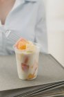Fruit yoghurt in office — Stock Photo