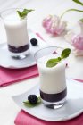 Closeup view of blackberry puree with vanilla flavoured buttermilk — Stock Photo