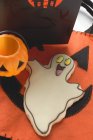 Ghost biscuit and Halloween decorations — Stock Photo