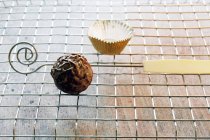 Chocolate truffle on a metal rack — Stock Photo