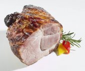 Roasted pork garnished with rosemary — Stock Photo