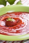 Closeup view of red fruit soup with strawberry — Stock Photo