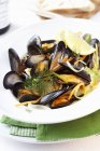 Steamed mussels in wine broth — Stock Photo