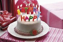 Birthday cake with fondant icing — Stock Photo