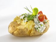 Baked potato with quark and chives — Stock Photo