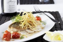 Fried fillet of sea bream on scallops — Stock Photo