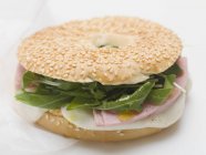 Cheese and rocket in bagel — Stock Photo