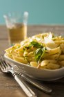 Penne pasta with basil and parmesan — Stock Photo