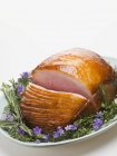 Partly carved Glazed roast ham — Stock Photo