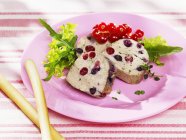 Poultry with redcurrants on plate — Stock Photo