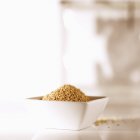 Sesame seeds in small dish — Stock Photo
