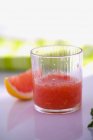 Grapefruit plup in glass — Stock Photo