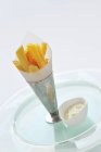 Potato fries in paper cone — Stock Photo