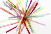 Closeup top view of colored drinking straws in a glass — Stock Photo