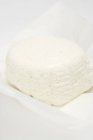 Ricotta cheese on paper — Stock Photo