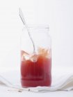Strawberry jam in jar with spoon — Stock Photo