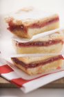 Closeup view of piled jam slices with icing sugar — Stock Photo