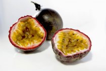 Halved passion fruits — Stock Photo
