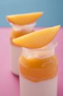 Two mango yoghurts — Stock Photo