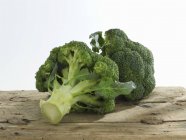 Fresh broccoli on wooden board — Stock Photo