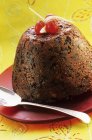 Plum pudding with fruits — Stock Photo