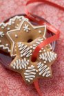 Gingerbread with red ribbon — Stock Photo