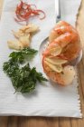 Garlic prawns on slotted spoon — Stock Photo