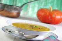 Pumpkin soup with pepper corns — Stock Photo