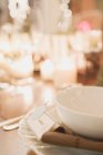 Closeup view of place setting with name card by candlelight — Stock Photo