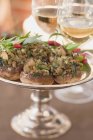 Closeup view of stuffed mushrooms with herbs and wine — Stock Photo