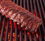 Rack of Pork Ribs on Grill — Stock Photo