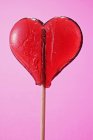 Heart-shaped lollipop, close-up — Stock Photo