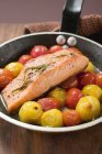 Fried salmon and cherry tomatoes — Stock Photo