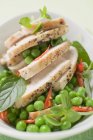 Chicken breast with peas — Stock Photo