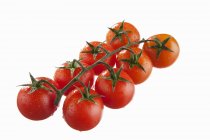 Cherry tomatoes with drops of water — Stock Photo