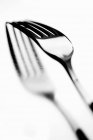 Closeup view of one metal fork with reflection on bright background — Stock Photo
