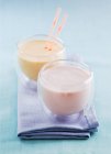 Closeup view of strawberry drink and a mango lassi — Stock Photo