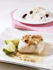 Closeup view of cod fillet with nuts — Stock Photo