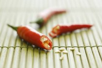 Chillies whole and halved — Stock Photo