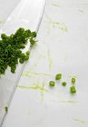 Fresh chopped chives with knife — Stock Photo