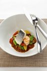 Sea bass and prawns with vegetables — Stock Photo