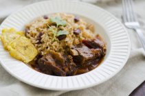 Goat ragout with beans and rice — Stock Photo